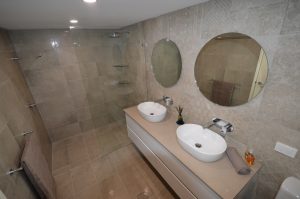 photo of renovated bathroom with double vanity
