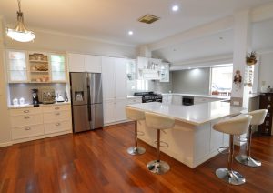 kitchen setting with white chairs